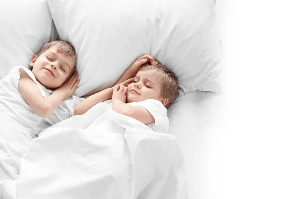 stock photo cute boys sleeping in bed under blanket closeup 401081254